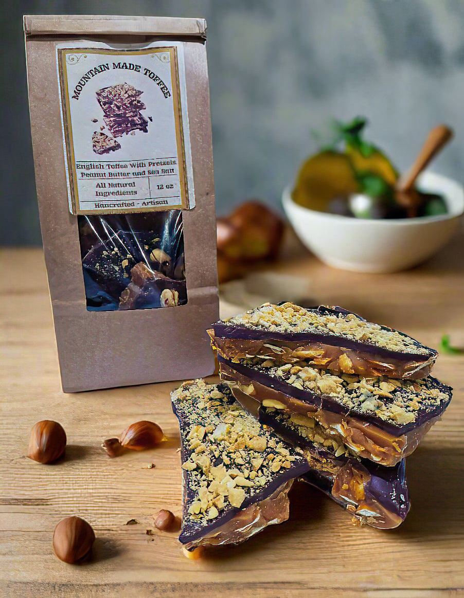 Mouthwatering toffee layered over whole pretzels, peanut butter drizzled with peanut butter and topped with a generous layer of chocolate and sprinkled with chopped peanuts